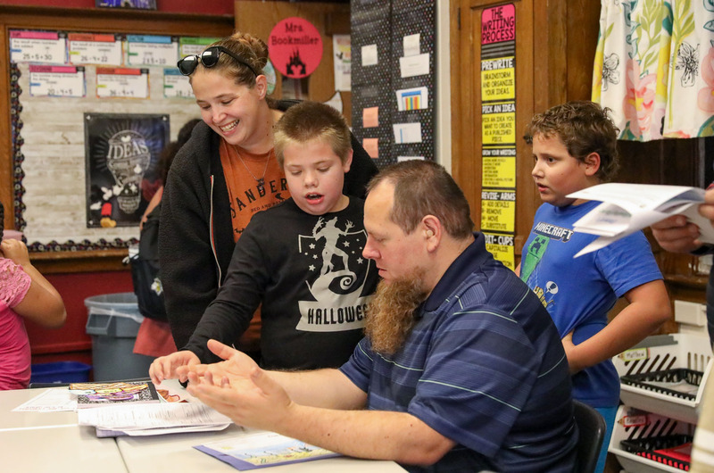 parents looking at students classwork