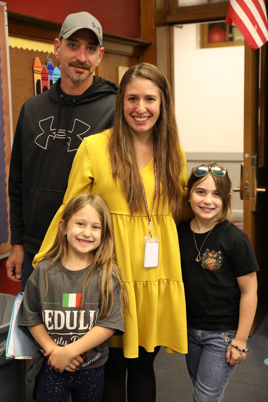 parents and their children at open house
