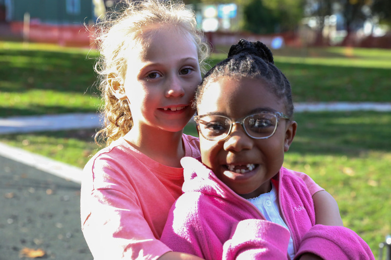 two girls playing on the playground