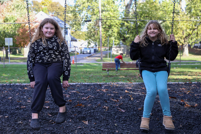 two girls on the swing