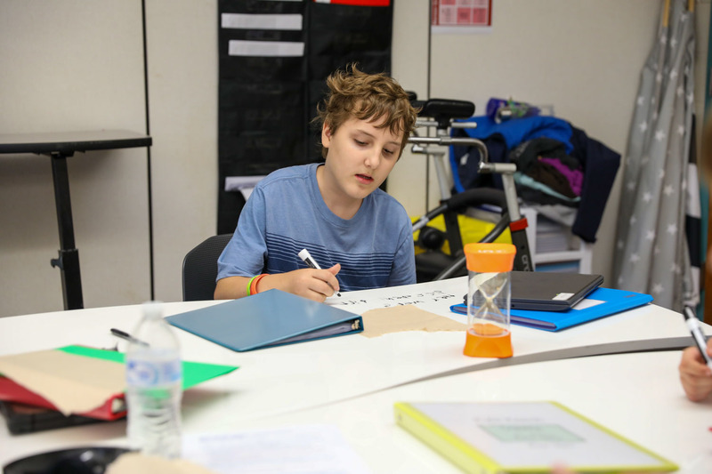 student writing notes
