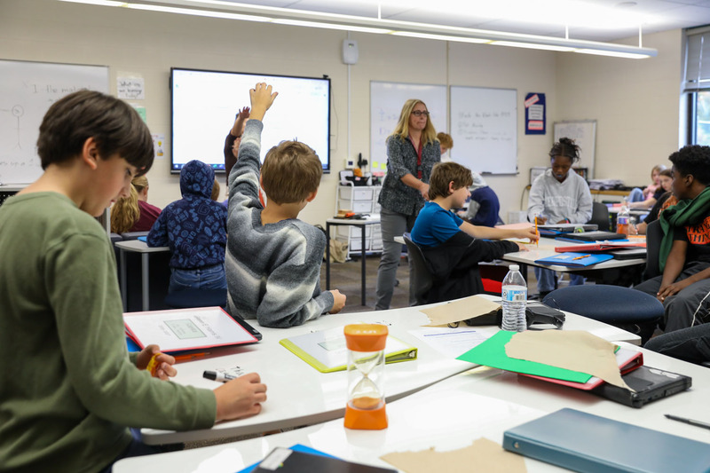 student raising hand