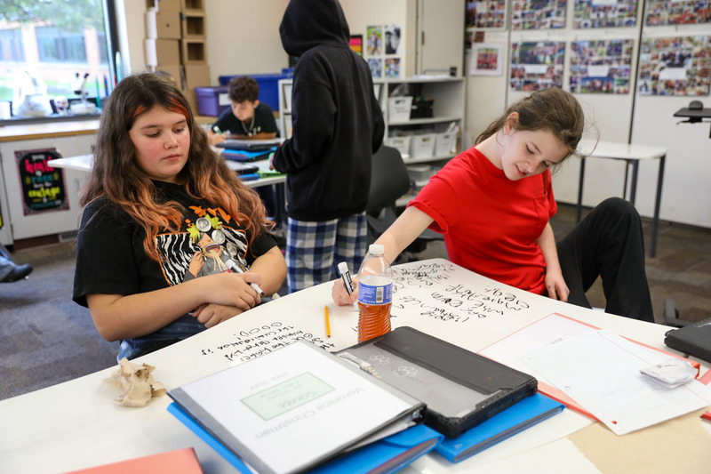 students sitting at table working