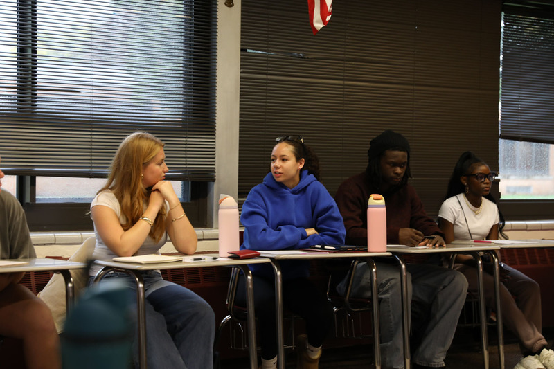 student talking to cori