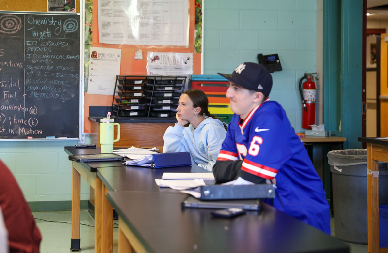 students at desk paying attention