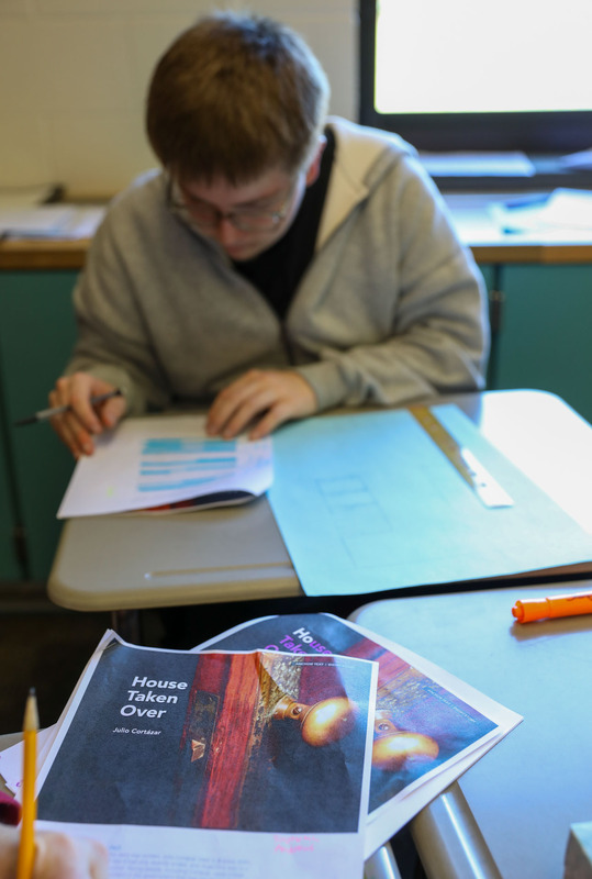 picture of text with student working in background