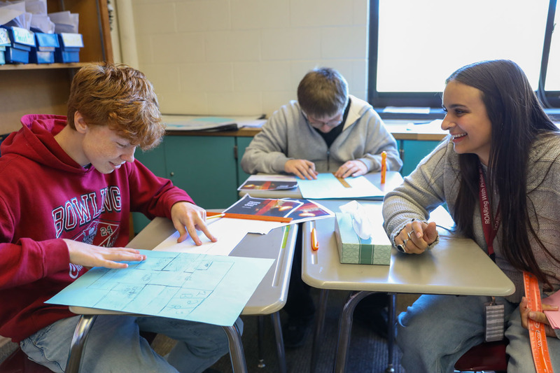 Ms. Ouderkirk working with students