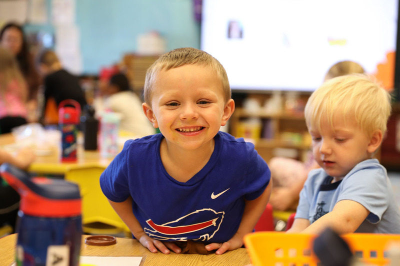 upk student smiling in class
