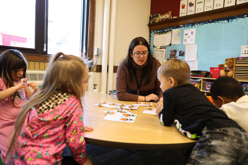 Teacher working with student