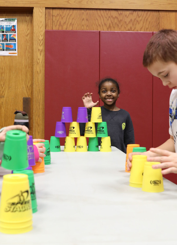 student stacking cups