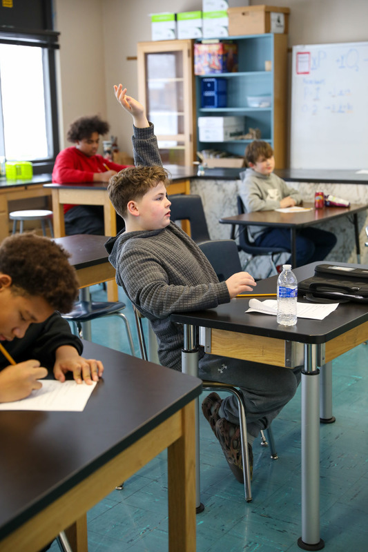 student raising hand