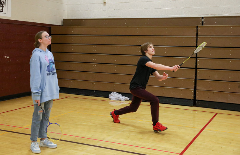 students playing badminton in pe