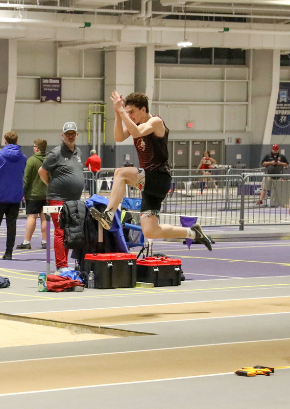 student doing the long jump
