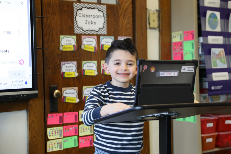 student posing to present