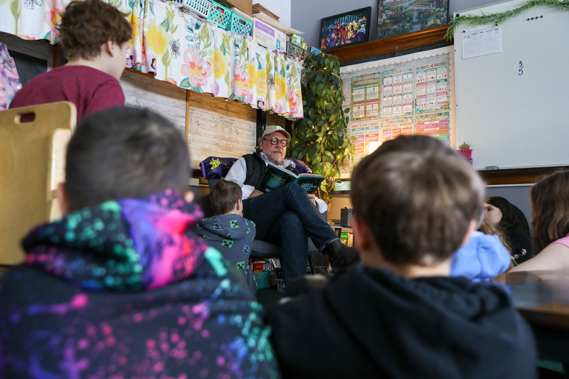 mr. poole reading to students