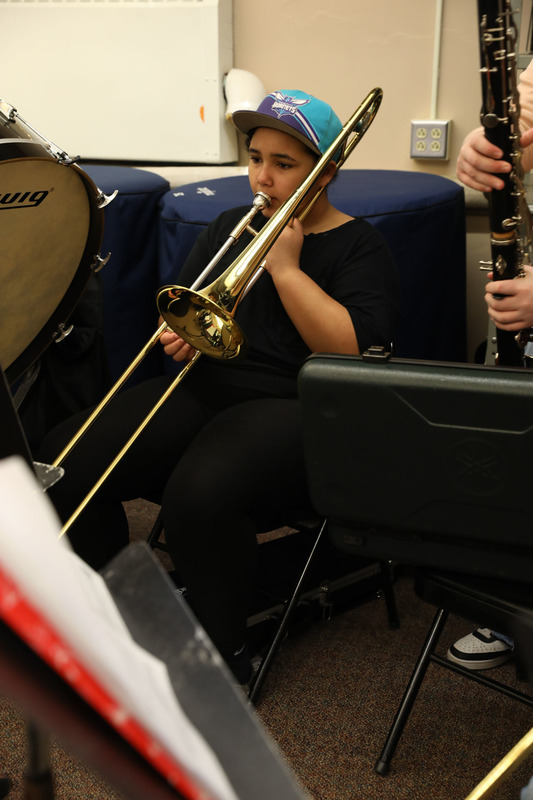 student practicing in band