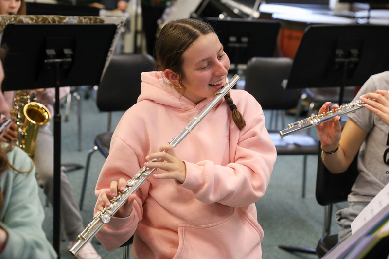 student playing flute