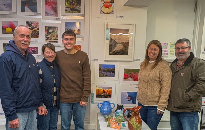 student with their family at the art show