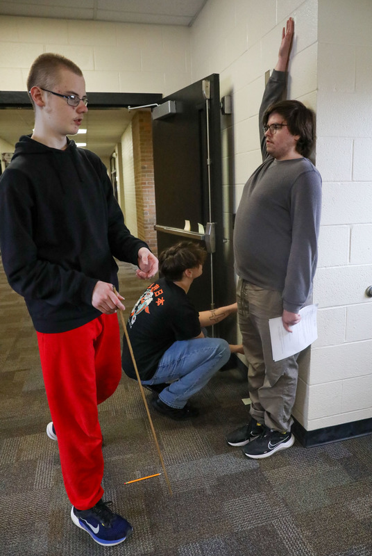 students working on physics activity