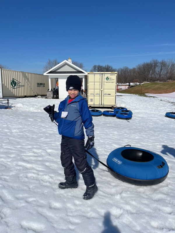 student snowtubing
