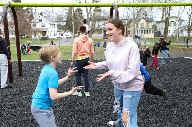 student and mentor on playground