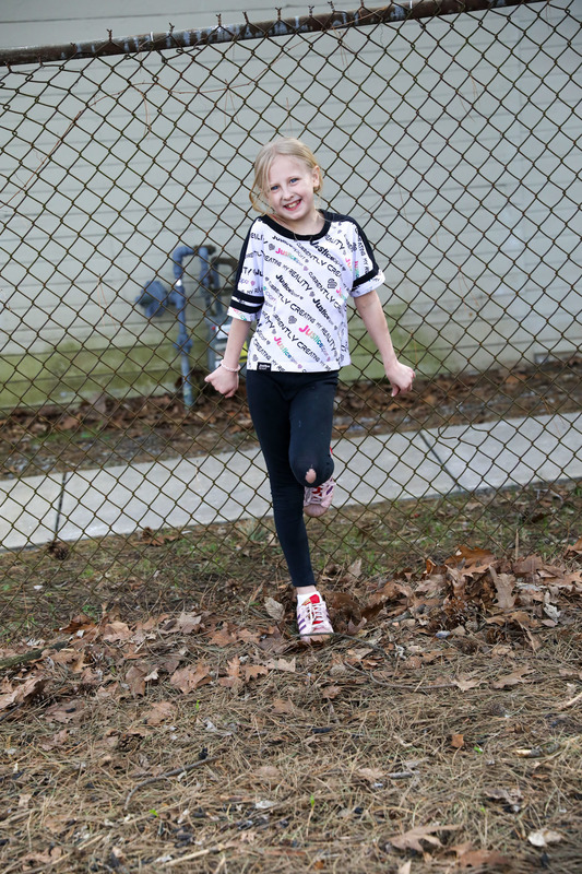 student posing outside