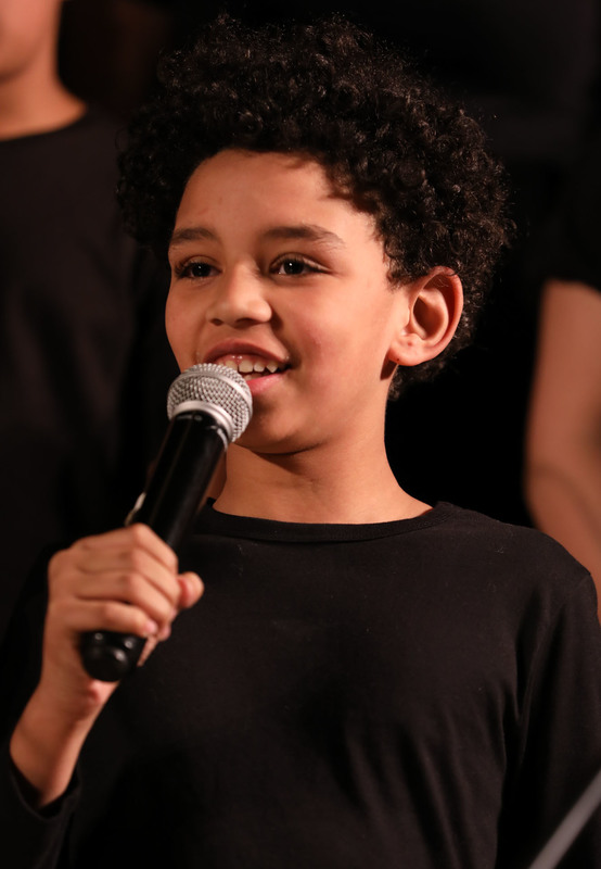 student performing in chorus concert