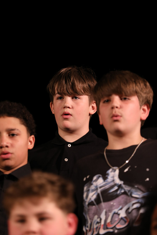 student performing in chorus concert