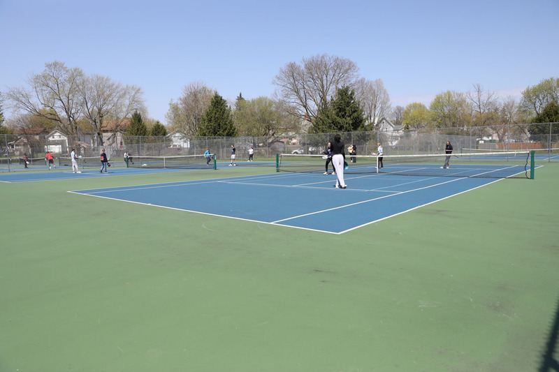 students playing pickleball outside