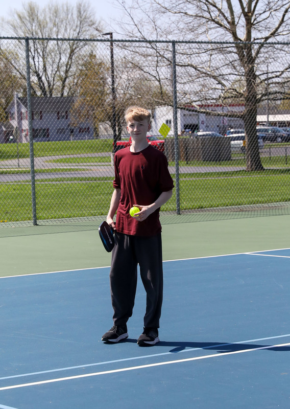 students playing pickleball outside