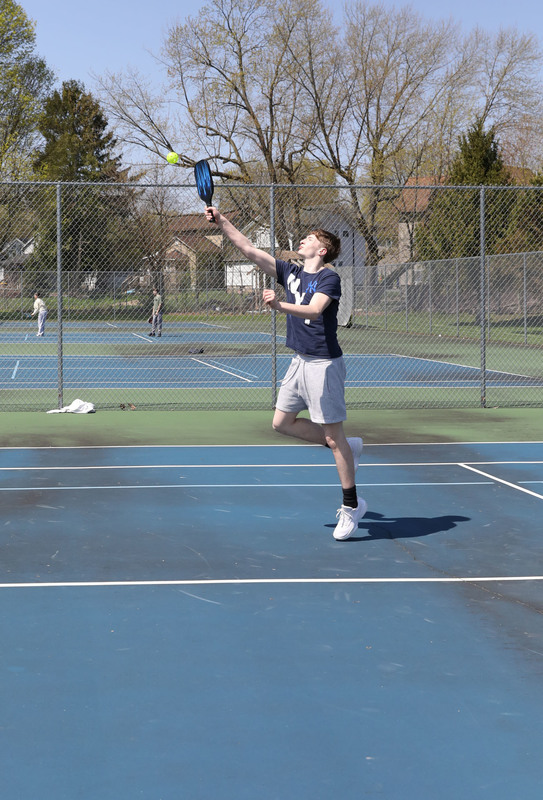 students playing pickleball outside
