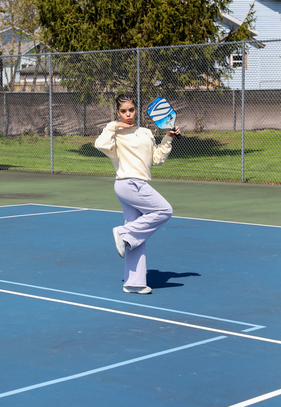 students playing pickleball outside