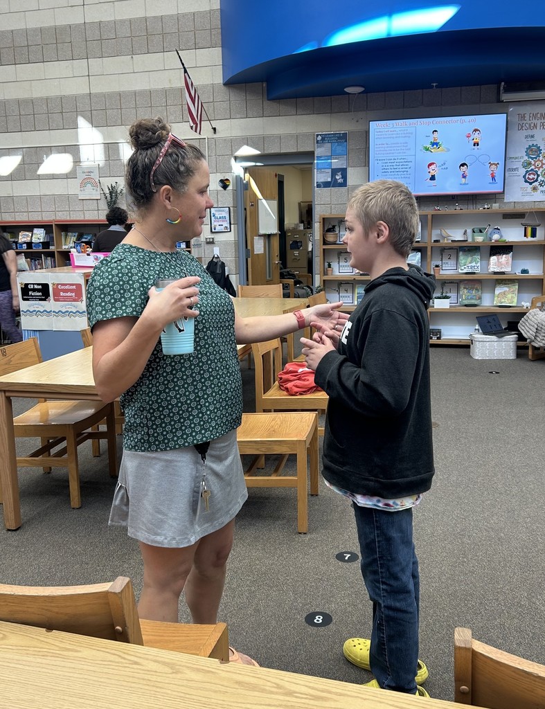 students in these pictures are involved in team building, exploring new books, and a hands-on STEM projects.