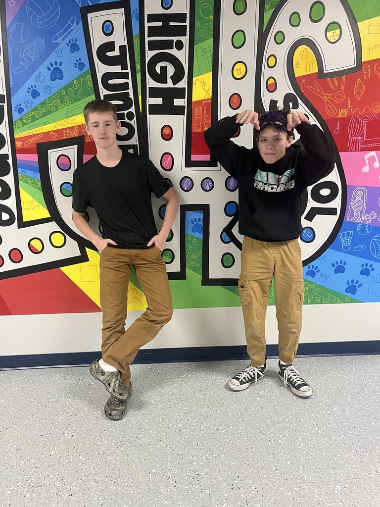 Students posing for pictures while celebrating spirit week