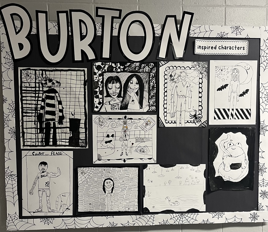 students showing off their spooky art.