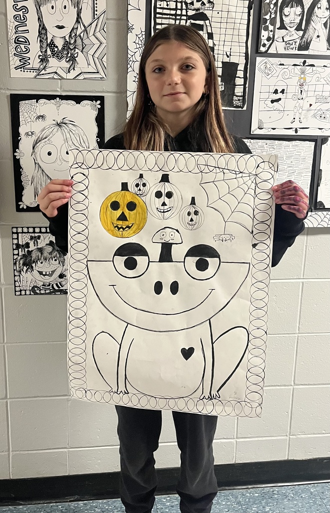 students showing off their spooky art.