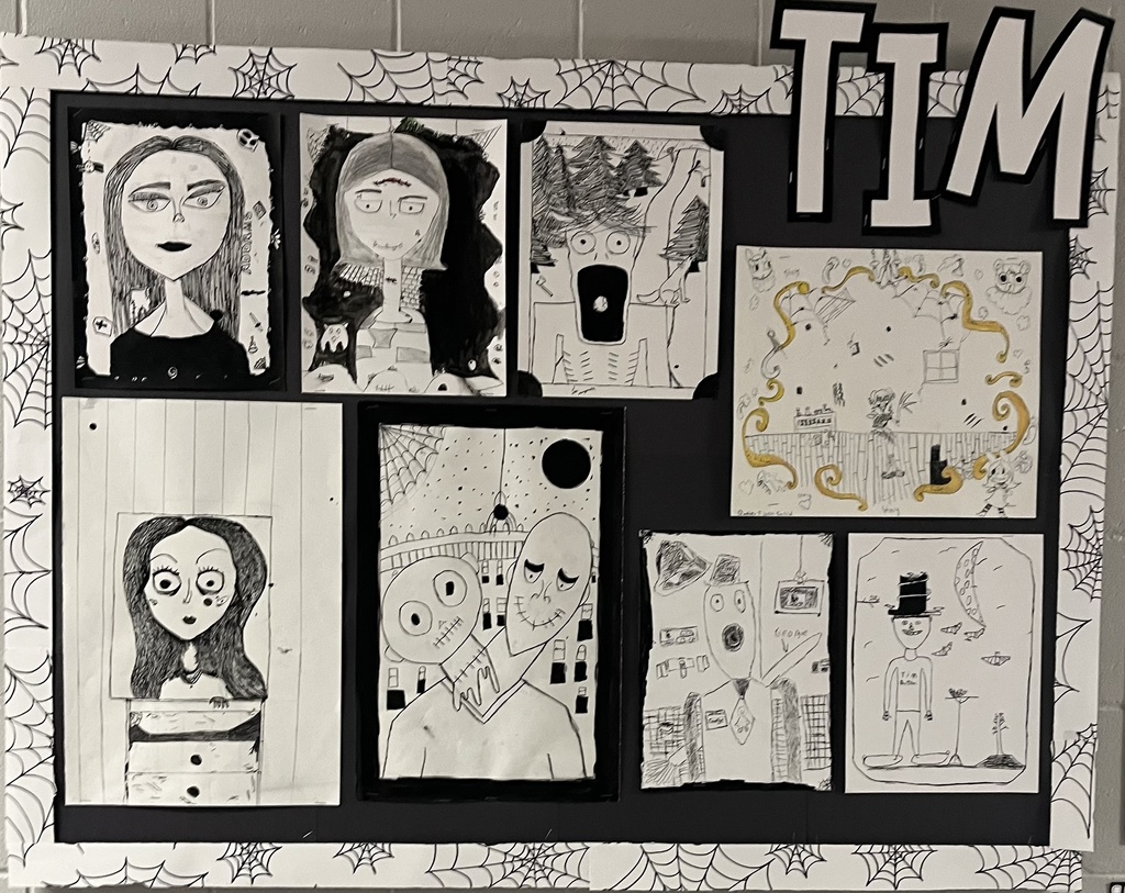 students showing off their spooky art.