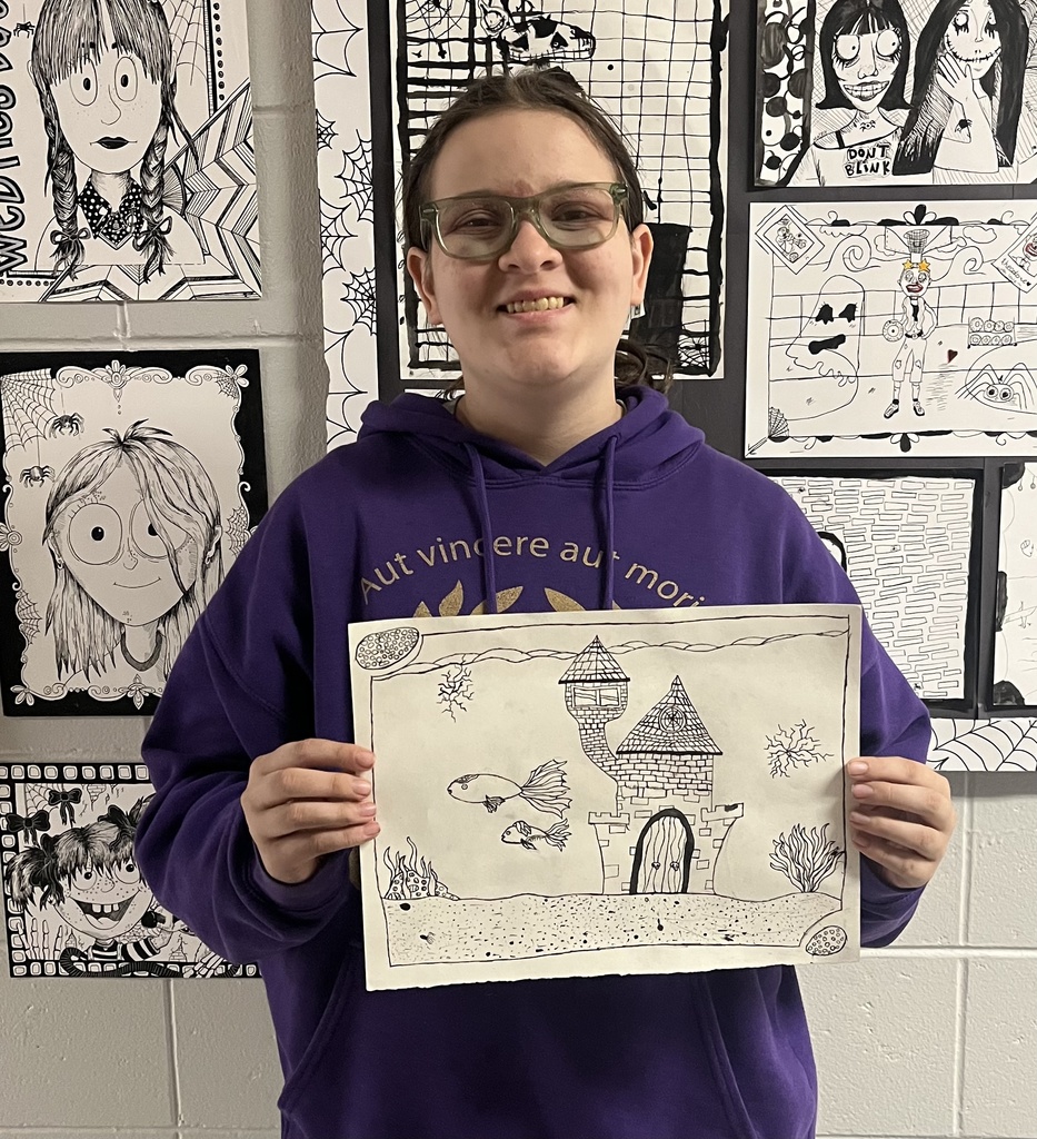 students showing off their art.