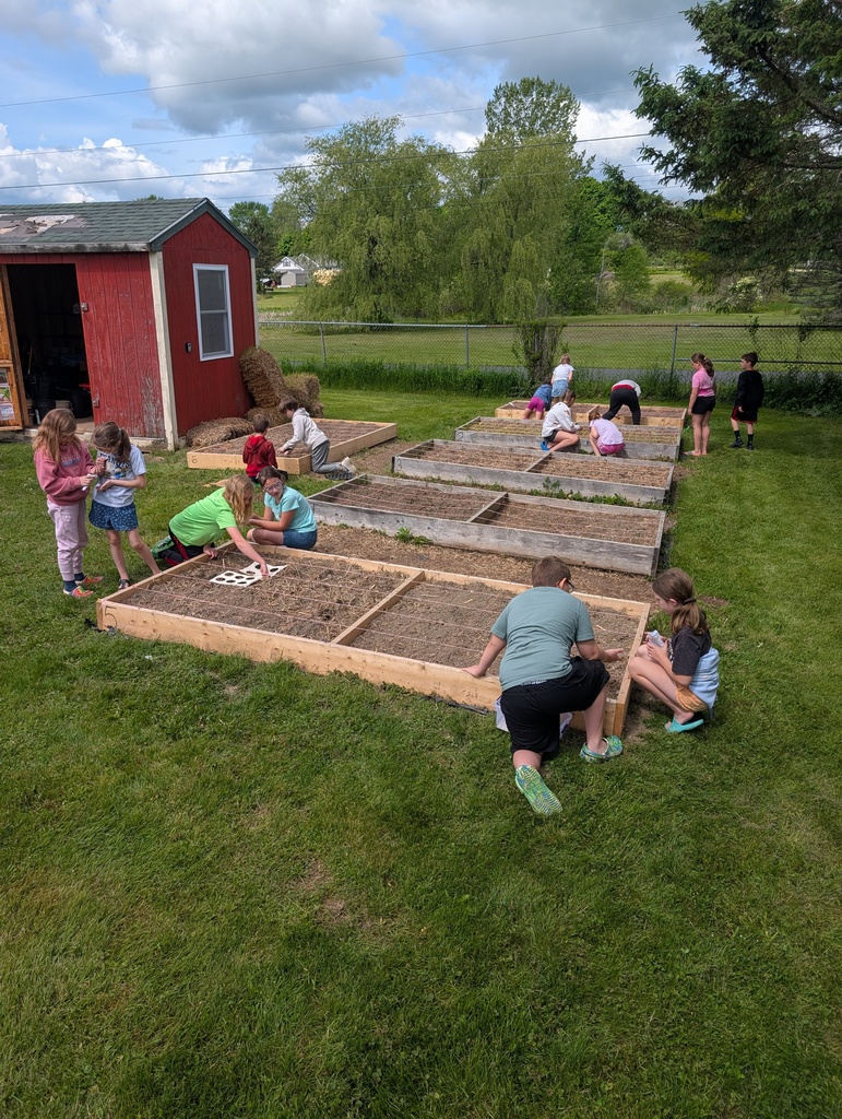 students working in a garden.