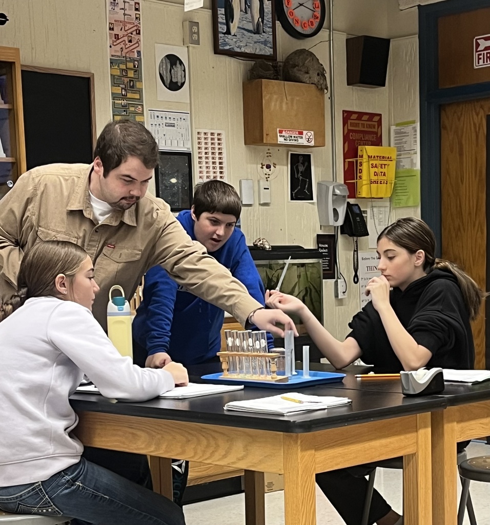 students working on a science experiment. 
