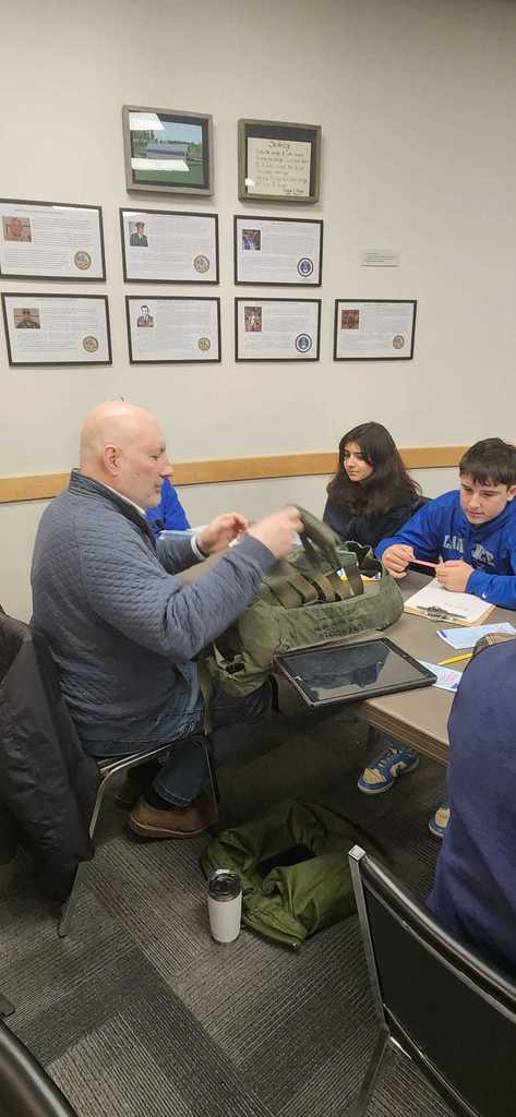 pictures of students interviewing and meeting veterans.
