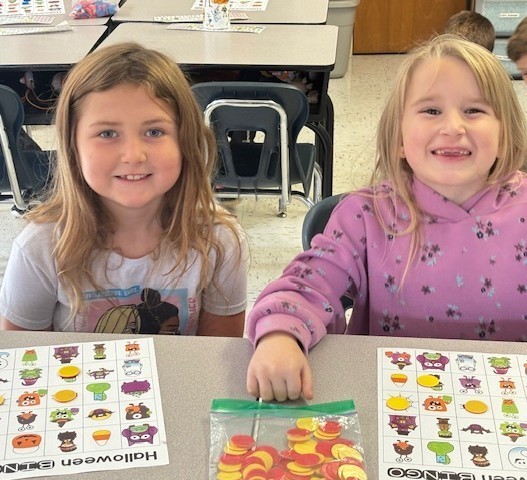 students showing their art.