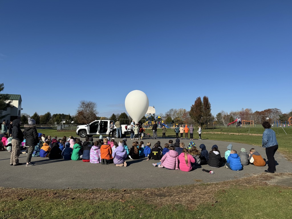 students watching the balloon take off.