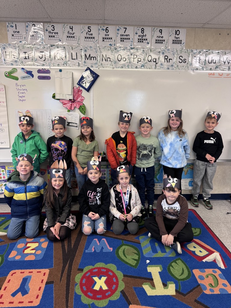 students posing with with their turkey crafts