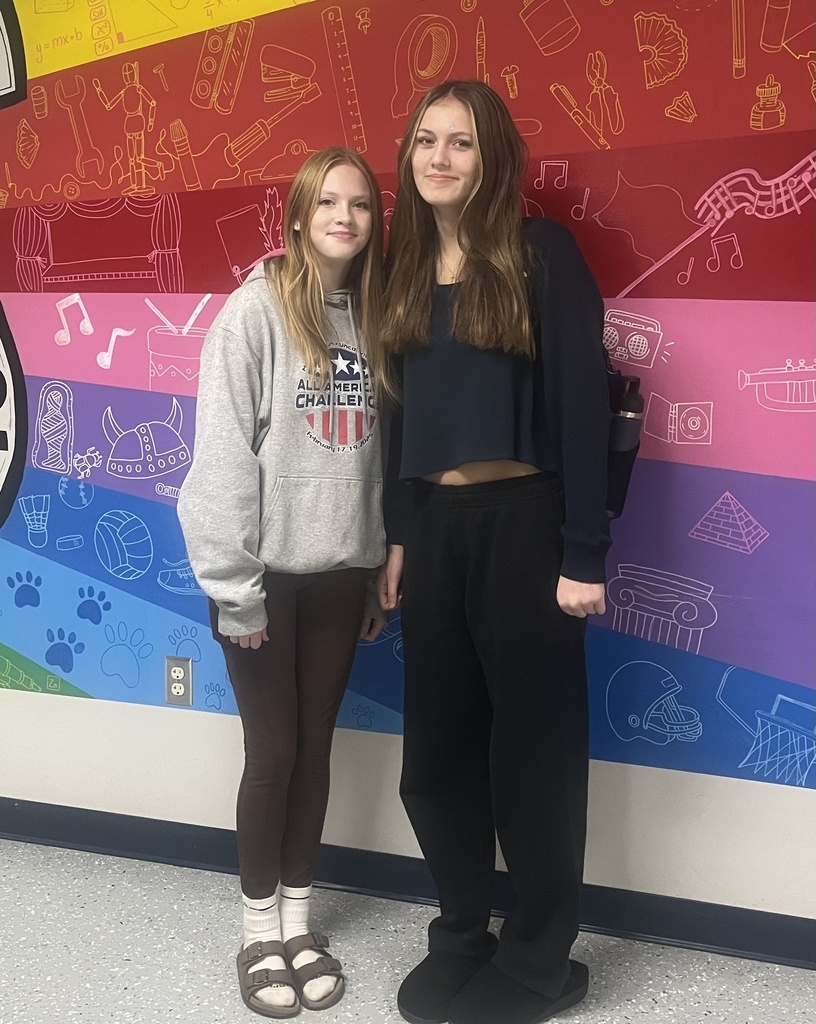 students posing for a picture in the halls