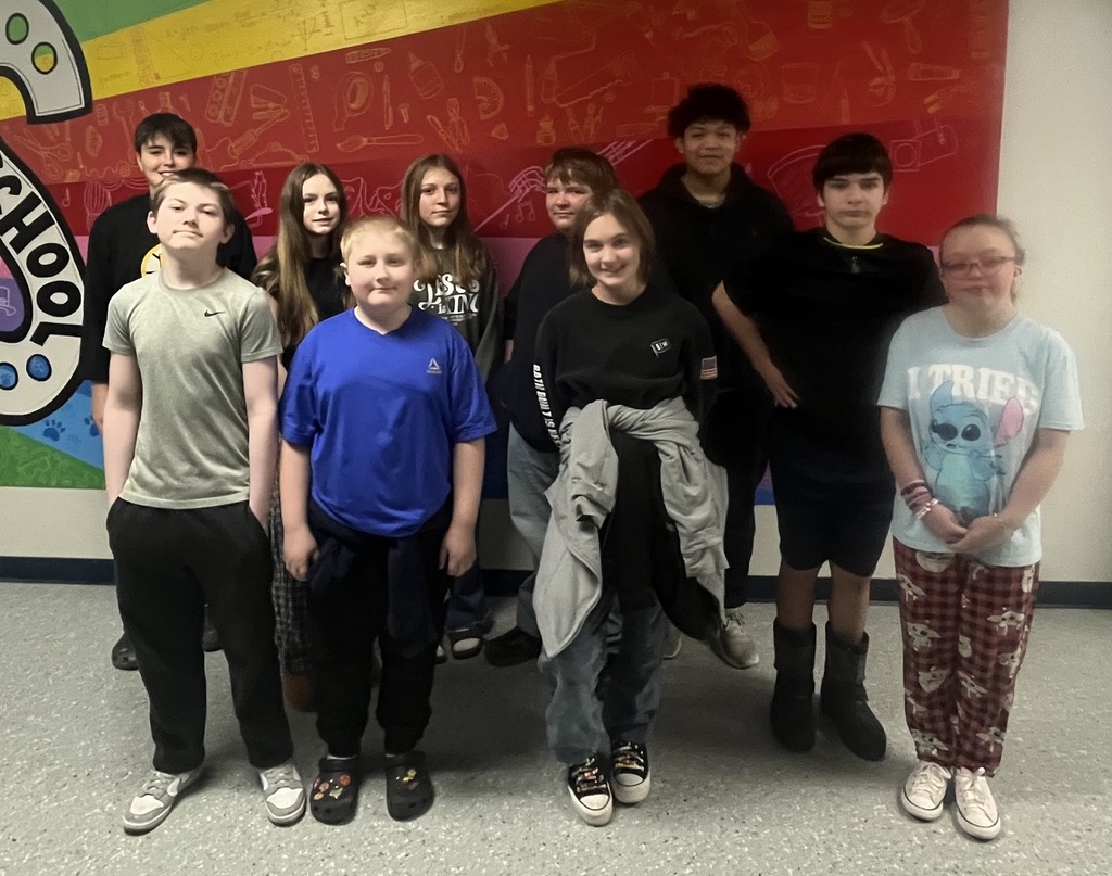 students posing for a picture in the halls