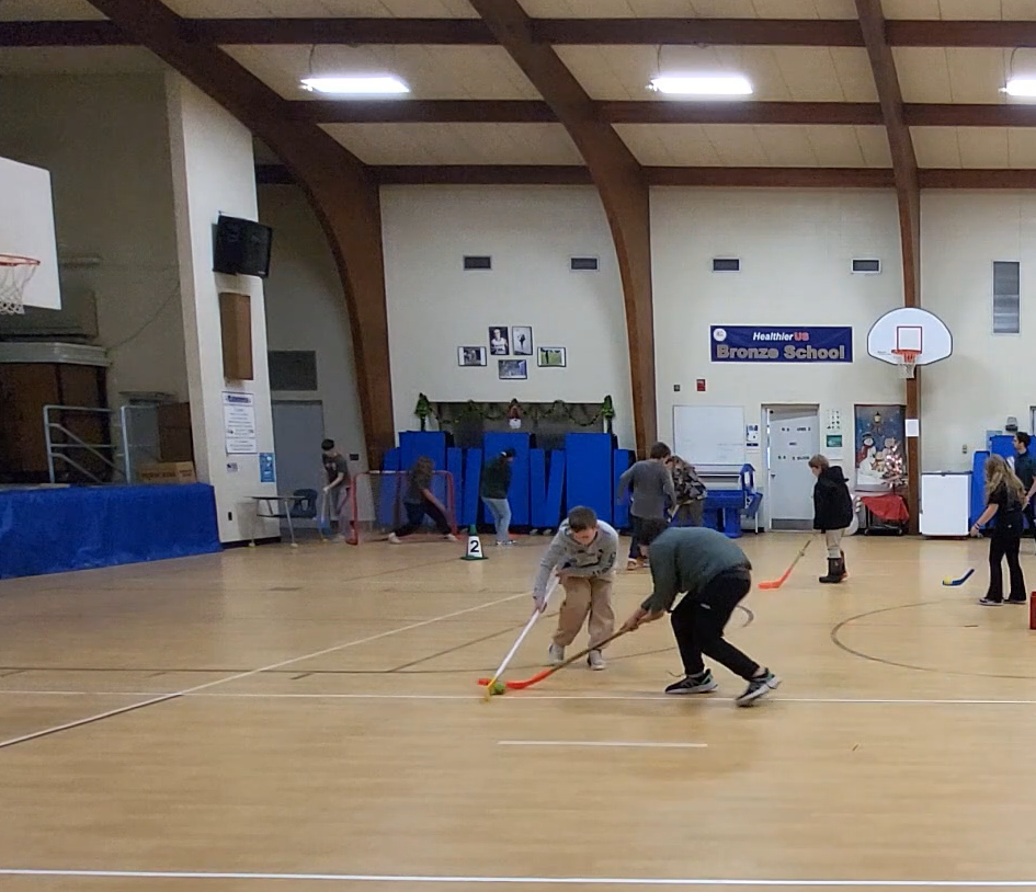 students learning about hockey in Physical Education class!