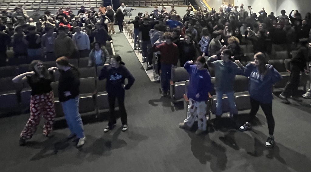 Students participating in a event during a presentation from the American Heart Association. 