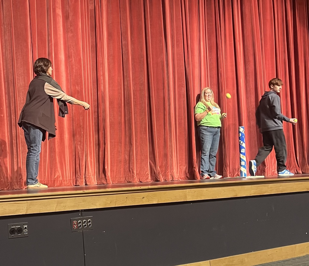 Students participating in a event during a presentation from the American Heart Association. 