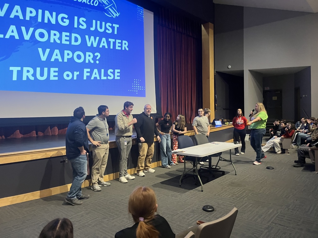 Students participating in a event during a presentation from the American Heart Association. 
